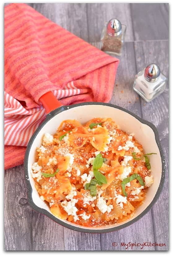 Pasta with Fresh Tomato Sauce and Ricotta for National Pasta Month served in a small ceramic frying pan