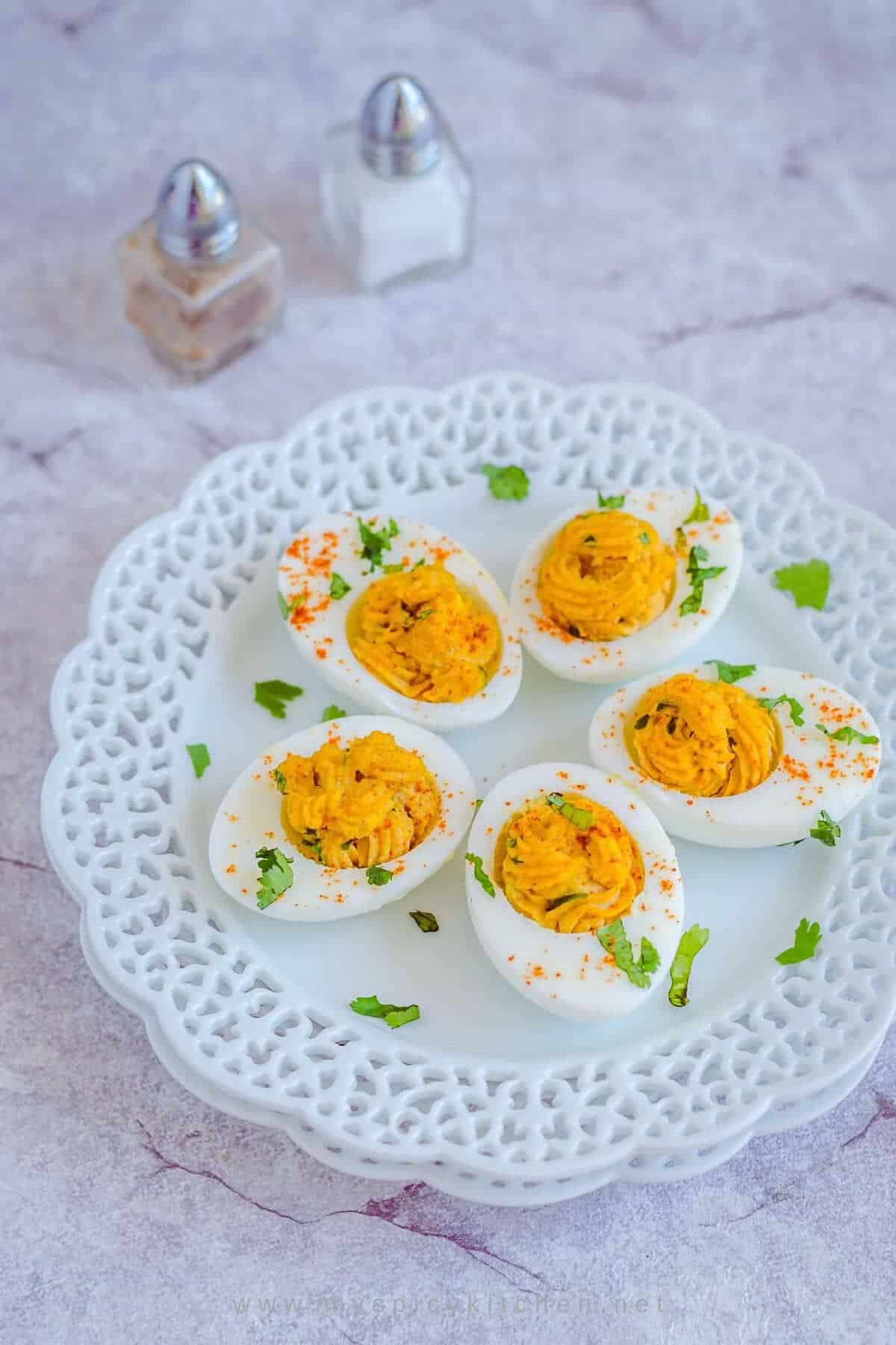 Curried deviled eggs are seasoned with curry powder garam masala and chili powder.  Great side dish and a starter